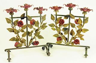 A PAIR OF POLYCHROME PAINTED WROUGHT IRON CANDELABRA IN THE FORM OF THREE FLOWERS