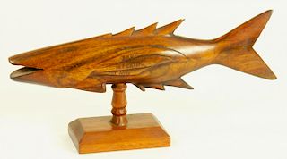 A PITCAIRN ISLANDS CARVED WOOD SCULPTURE OF A FISH, STAMPED IN PRINTER'S TYPE FROM PITCAIRN