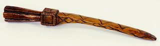 TREEN.  A 19TH CENTURY CARVED WOOD KNITTING SHEATH, THE HANDLE WITH A HEART AND FLAG