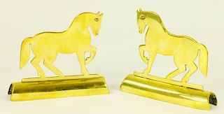A PAIR OF VICTORIAN BRASS HORSE HEARTH ORNAMENTS