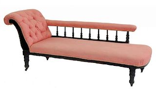 AN EDWARDIAN CARVED AND STAINED MAHOGANY CHAISE LONGUE