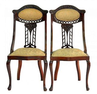A PAIR OF EDWARDIAN CARVED MAHOGANY SALON CHAIRS