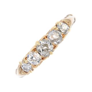 An Edwardian 18ct gold diamond five-stone ring. The graduated old and brilliant-cut diamond line, to