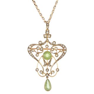 An early 20th century 15ct gold peridot and split pearl pendant. The circular-shape peridot, within