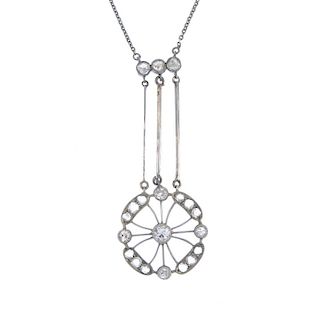 An early 20th century diamond pendant. The old and rose-cut diamond openwork panel, suspended from t