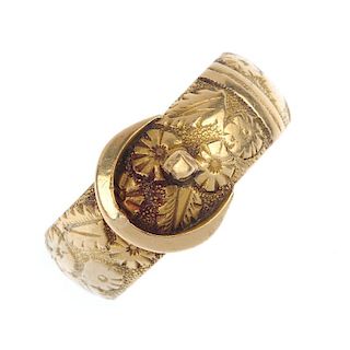 A late Victorian 18ct gold buckle ring. Designed as a belt, with floral texture. Hallmarks for Chest