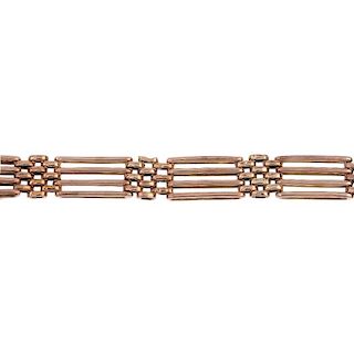 An early 20th century 9ct gold bracelet. Designed as a series of alternating gate and brick-links, t