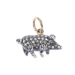 A diamond and gem-set pig pendant. Designed as a standing pig, set throughout with rose-cut diamonds