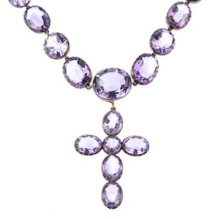 A group of amethyst jewellery. To include an early 20th century amethyst cross pendant suspended fro
