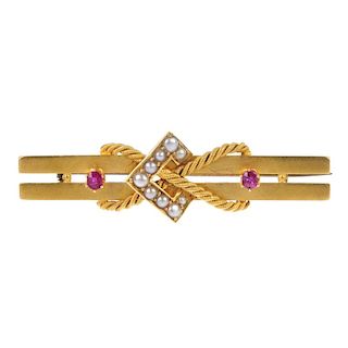 A late 19th century 15ct gold ruby and split pearl brooch. The stylised rope-twist and split pearl b
