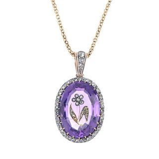 An early 20th century silver and gold, amethyst and diamond pendant. The oval-shape amethyst with ro