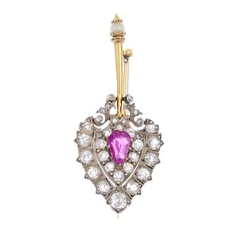 A Burmese ruby and diamond brooch. The pear-shape Burmese ruby, within an old and rose-cut diamond s