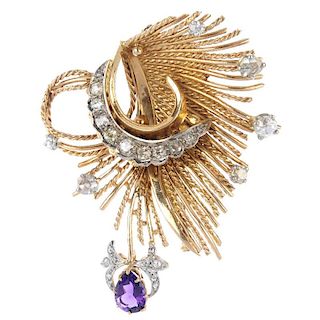 A diamond and amethyst brooch. The rope-twist and plain wire stylised foliate panel, with old and ro