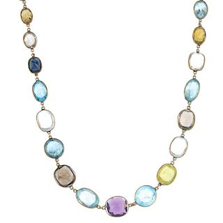 A multi gem-set necklace. The graduated vari-shape gem-set line, consisting of vari-hue zircon, quar