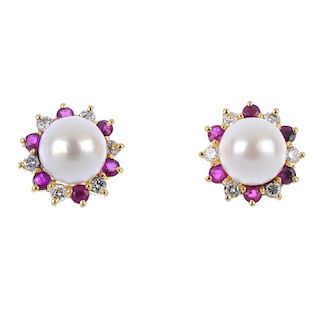 A pair of 18ct gold cultured pearl, ruby and diamond ear studs. Each designed as a cultured pearl, m