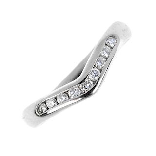 A platinum diamond ring. The brilliant-cut diamond chevron, within a channel setting, to the plain b