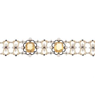 An early 20th century gold citrine, enamel and split pearl bracelet. Designed as two cushion-shape c