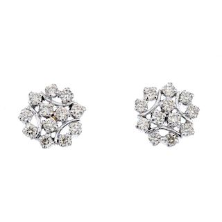 A pair of diamond cluster ear studs. Each of openwork design, the brilliant-cut diamond trefoil, to