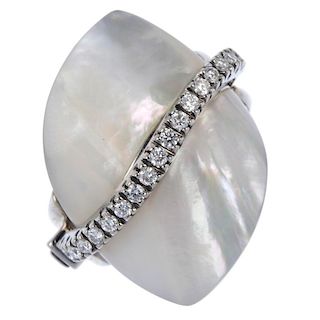 An 18ct gold mother-of-pearl and diamond dress ring. The removable mother-of-pearl panel and hinged