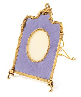 A RUSSIAN GILT SILVER AND GUILLOCHE ENAMEL FRAME, WORKMASTER MIKHAIL PERCHIN FOR FABERGE, ST. PETERSBURG, CIRCA 1890 
