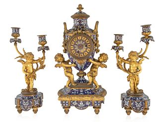 A FRENCH ORMOLU AND CHAMPLEVE ENAMELLED THREE-PIECE GARNITURE, 19TH CENTURY 