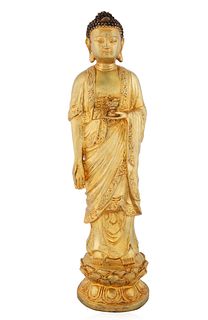 A GILT-BRONZE STANDING BUDDHA SCULPTURE 