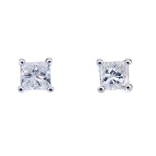 A pair of 18ct gold square-shape diamond single-stone ear studs. Total diamond weight 0.33ct, stampe