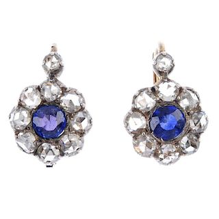 A pair of diamond and gem-set earrings. Each designed as a circular-shape garnet-topped-doublet or a
