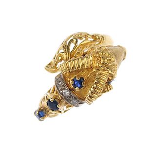 A sapphire and diamond ram ring. Designed as a textured rams head and openwork tail, with single-cut