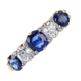 A sapphire and diamond ring. The graduated oval-shape sapphire line, with old-cut diamond spacers, t