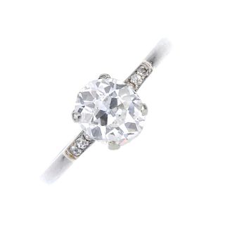 A platinum diamond single-stone ring. The oval-shape diamond, with single-cut diamond shoulders, to