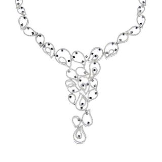 An 18ct gold diamond and gem-set necklace. Of openwork design, the cascade of brilliant-cut diamond