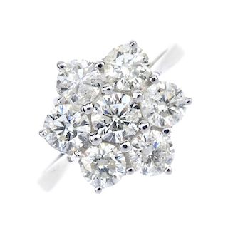 A diamond cluster ring. The brilliant-cut diamond, within a similarly-cut diamond surround, to the t
