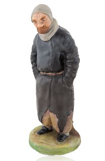 A RUSSIAN PORCELAIN FIGURINE OF PLIUSHKIN FROM GOGALS 'DEAD SOULS', GARDNER PORCELAIN FACTORY, VERBILKI, MOSCOW, 1870-1890