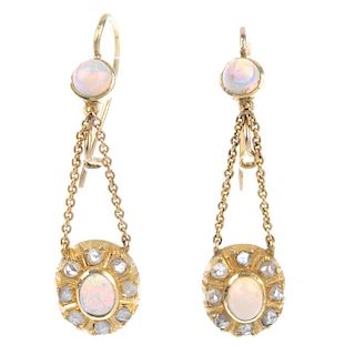 A pair of opal and diamond ear pendants. Each design as an oval opal cabochon and rose-cut diamond c