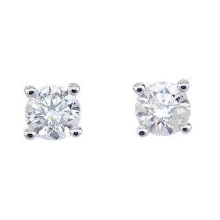 A pair of 18ct gold brilliant-cut diamond single-stone ear studs. Total diamond weight 0.50ct, stamp
