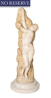 A MARBLE SCULPTURE OF A NUDE WOMAN AGAINST A NATURAL ROCK, LATE 19TH-EARLY 20TH CENTURY 