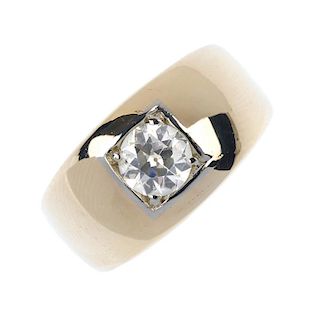 A gentleman's gold diamond single-stone ring. The circular-cut diamond, inset to the tapered panel,