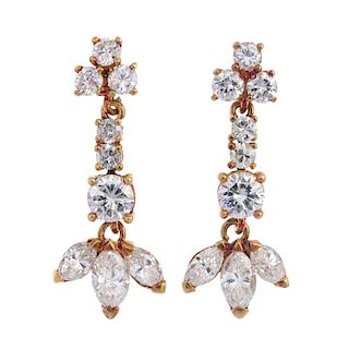 A pair of diamond ear pendants. Each of articulated design, the marquise-shape diamond trio, suspend