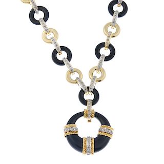 An onyx and diamond necklace. The tapered onyx hoop pendant, with overlaid single-cut diamond line a