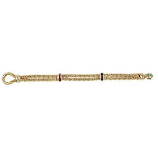 An 18ct gold diamond and gem-set bracelet. The looped rope-twist chain, with calibre-cut sapphire, e
