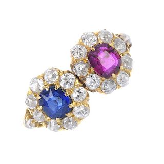 A diamond, sapphire and ruby twin cluster ring. The cushion-shape ruby, within an old-cut diamond su