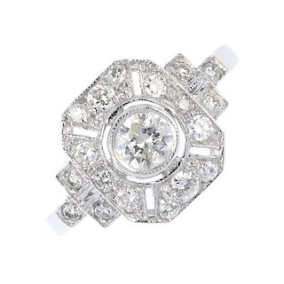 A diamond dress ring. The brilliant-cut diamond collet, to the similarly-cut diamond panel and sides