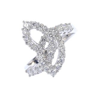 An 18ct gold diamond foliate dress ring. Of openwork design, the two brilliant-cut diamond interlock