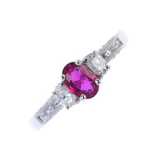 * An 18ct gold ruby and diamond dress ring. The oval-shape ruby and diamond sides, to the baguette-c
