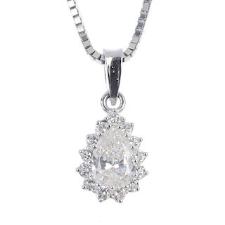 A diamond cluster pendant. The pear-shape diamond, within a brilliant-cut diamond surround, suspende