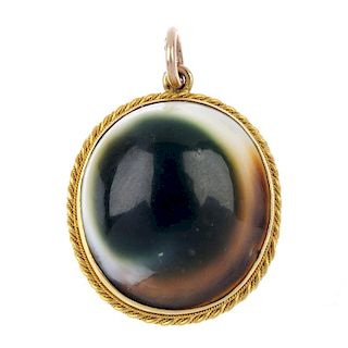 An operculum pendant. The oval-shape shell operculum, to the late 19th century gold rope-twist mount