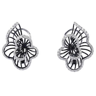 A pair of 18ct gold diamond floral earrings. Each designed as a graduated brilliant-cut diamond scal