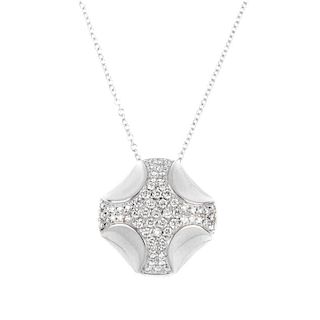 ASPREY - a diamond pendant. The brilliant-cut diamond cross, with concave detail, suspended from an