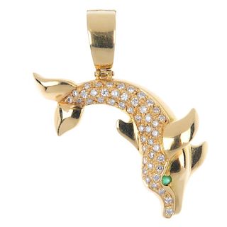 CARTIER - a diamond and emerald dolphin pendant. The pave-set diamond body, to the circular chrysopr